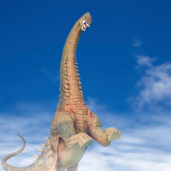 alamosaurus in a blue sky background