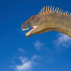 alamosaurus in a blue sky background