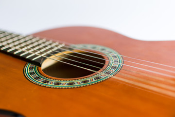 Obraz premium Classic acoustic guitar on white background view.