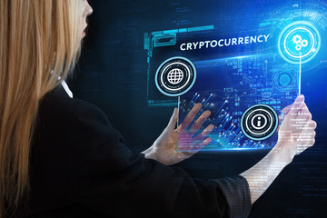 The concept of business, technology, the Internet and the network. A young entrepreneur working on a virtual screen of the future and sees the inscription: Cryptocurrency
