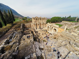 Aerial view of Celcius Library from Ephesus Ancient City with some tourists in view.