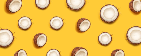 Tropical abstract coconut pattern on yellow background. Flat lay.