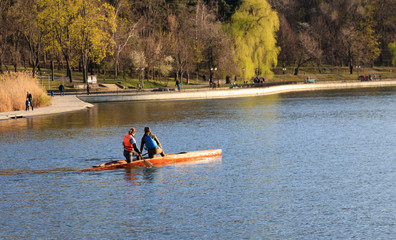 two girls are riding a kayak