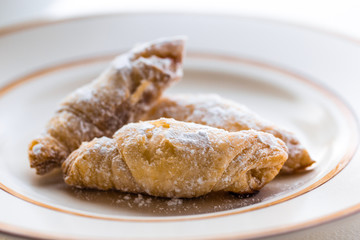 Cornulețe. A traditional Romania dessert that is a small croissant stuffed with jam or Turkish delight sprinkled with icing sugar
