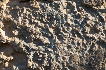 Texture background of sandstone in the sunlight