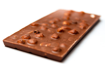 chocolate with hazelnuts on white background