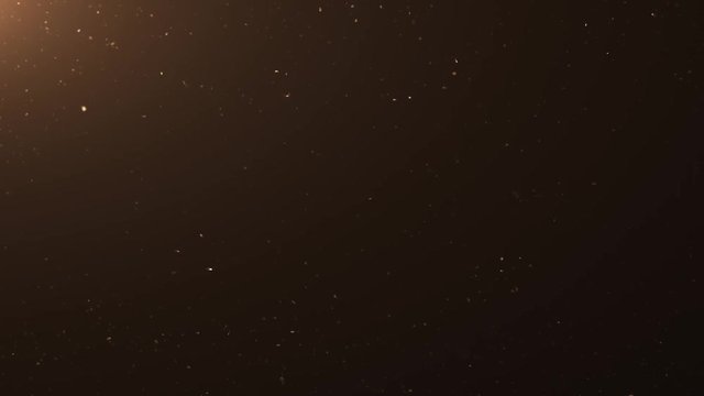 Animated dust smoke chalk particle background over a dark background with warm lens flare.