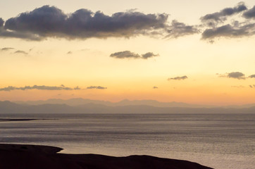 Fototapeta premium sunrise landscape Red Sea coast with silhouette of high mountains and sky with clouds in Egypt