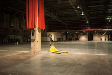 Pallet jack sits in empty convention hall