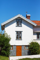 White wooden house with gable