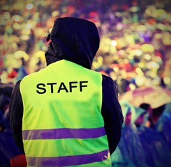 people during live outdoor concert and a boy of Staff when it is