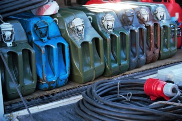 Metal fuel jerrycans and power extander. Colorful canisters for storing and transportation fuel and other petroleum products.