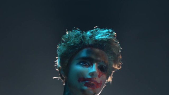 Scary mutilated doll face. Horror concept shot.