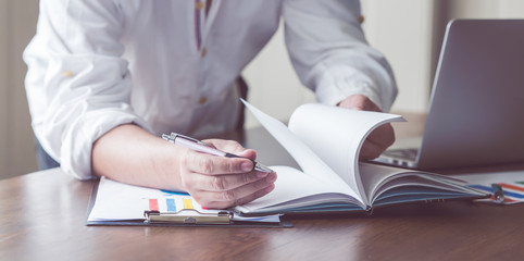 businessman check the work documents in office,The media reaches the operational guidelines