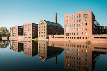 reflection in water of apartment, in street Bergpoortstraat, in Deventer, The Netherlands. Old...