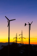 Future of Renewable Energy. Wind Turbines High Voltage Plantation at Sunset