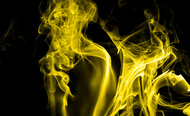 Yellow smoke on black background