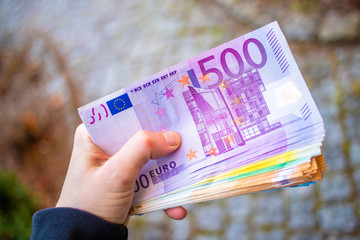 hand holding euro banknotes - obrazy, fototapety, plakaty