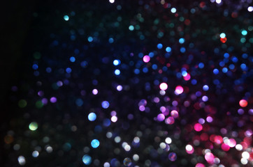 Obraz premium glitter vintage lights background. red, black, purple and blue. de-focused