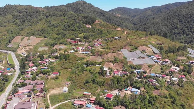 Beautiful Aerial drone footage beautiful rural Kundasang Town, Sabah, Malaysia during sunny day. Kundasang is a most famous tourist place in Sabah, Malaysia