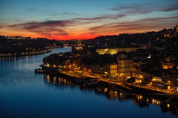 Naklejka premium Views of the Ribeira and Douro river from Dom Luis I bridge during a beautiful twilight, Porto, Portugal.