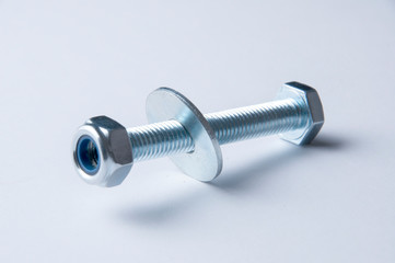 Metal bolt and nuts isolated on white background