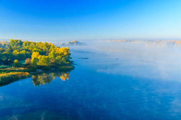 Fog over the water on a river Dnieper on autumn