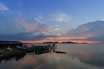 Fototapeta na wymiar Sunset landscape in Asia's summer lake