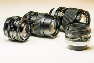 Three old photographic lenses