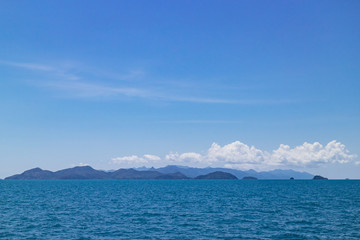 Clear sky with enormous cloud over islands and mountains over the sea at Koh Mak in Trat, Thailand. Perfect background for ocean travel, sea business with copy space.