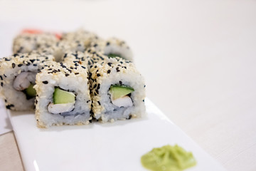 Sushi roll sushi with prawn, avocado, cream cheese, sesame. Sushi menu. Japanese food.