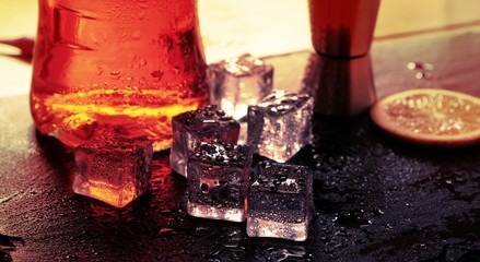 cocktail ice reflections drops light background water