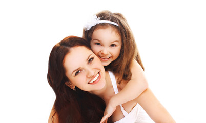 Portrait close-up happy smiling mother with little child daughter having fun on white background
