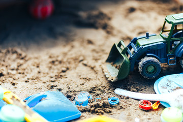 Summer Children's Toys on the sand, sand box, green tractor