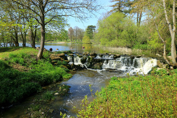 A small waterfall flowing from a lake in Kent