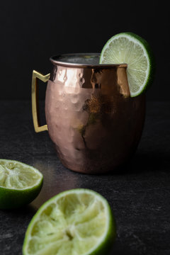 Moscow Mule with freshly squeezed lime on black background