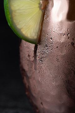 Close-up of Moscow Mule and lime slice in icy cold copper mug