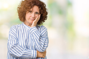 Beautiful middle ager senior woman wearing navy shirt over isolated background thinking looking tired and bored with depression problems with crossed arms.