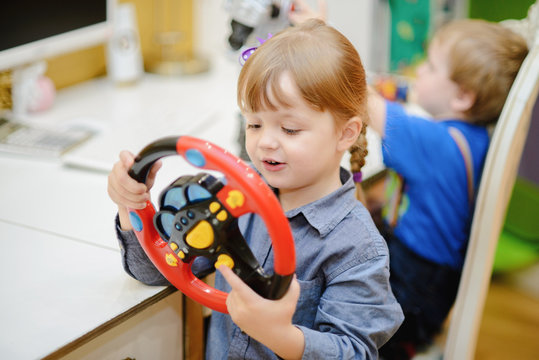 Girl With Toy Car Steering Wheel