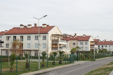 Pretty newly built homes and gardens near the road