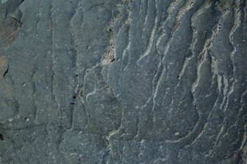 Background and black marble. Bedrock Stone In the forest near the waterfall