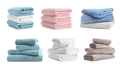 Set of folded soft terry towels on white background