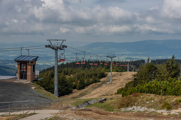 Fototapeta na wymiar Cable car from Ramzova village to Serak hill in spring morning