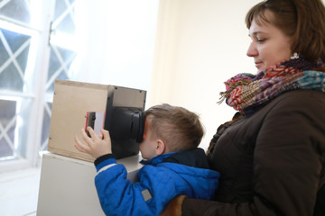 Family watching slides in stereoscope