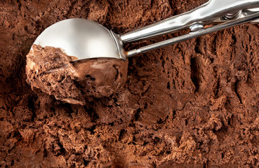 Chocolate  ice cream scoop.  Dark cocoa Ice-cream Background or Texture. Top view.