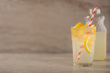Cocktail with lemonade with lemon and lime, cold refreshing drink or drink with ice