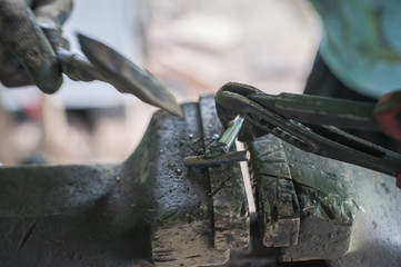 Cleaning metal with a hammer after welding