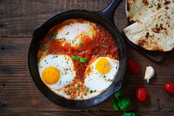 Homemade Shakshouka - Eggs poached in spicy tomato sauce