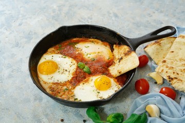 Homemade Shakshouka - Eggs poached in spicy tomato sauce