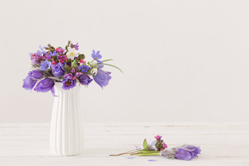 bouquet of spring violet flowers on white background